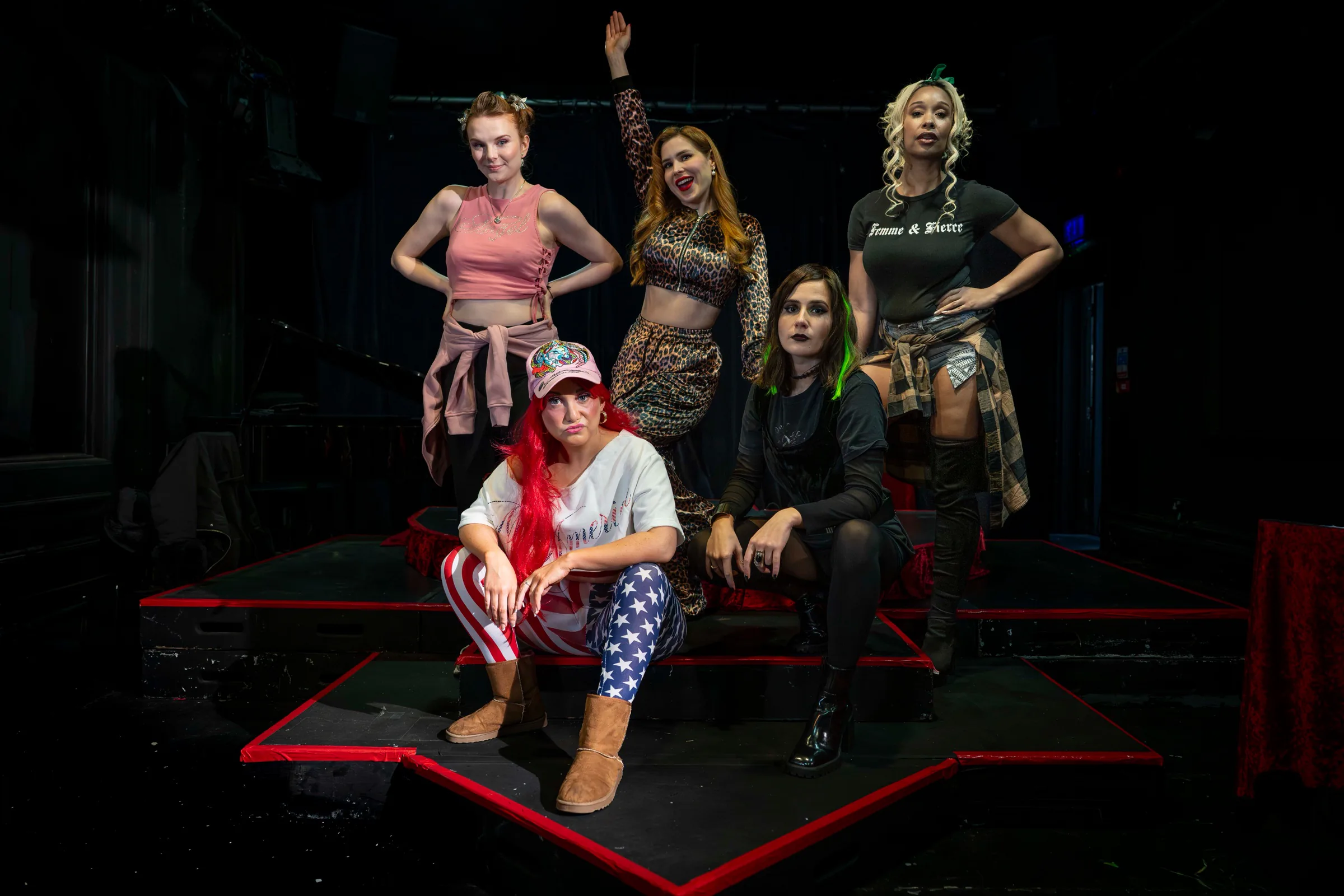 The five dancers of Kitty Clap Klub posed on the club’s heart-shaped stage