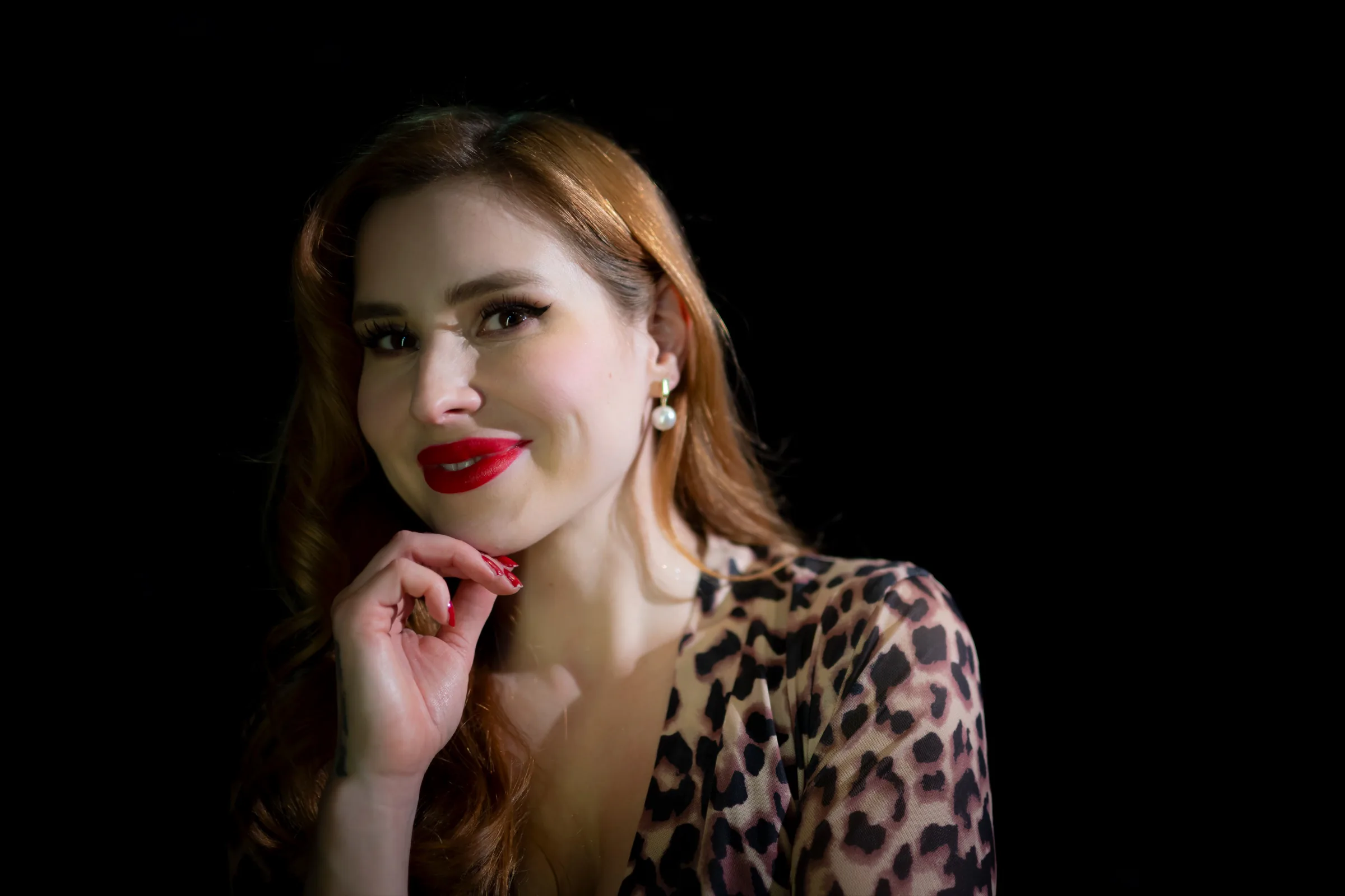 Chantelle in a leopard-print top, glamorous and mid-smile
